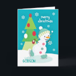 Cartão De Festividades Godson Christmas Snowman Ice Skating<br><div class="desc">Send a special Godson a fun and colorful Christmas card featuring a happy ice skating snowman with a colorful tree and snowflakes on a turquoise background. Snowman courtesy of Pretty Grafik.</div>