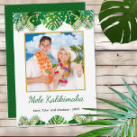 Cartão De Festividades Hawaiian Mele Kalikimaka Christmas Lights Photo<br><div class="desc">This fun, modern holiday card design features lush tropical beach foliage on the front, including palm fronds and monstera philodendron leaves, decorated with glowing multicolored lights, at the top and bottom. In the middle is a customizable gold-edged square photo that you can replace with your own. Below the photo are...</div>