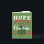 Cartão De Festividades Hope Your Christmas Rocks Greeting Card<br><div class="desc">Here's the perfect Christmas card for your favorite musician or music lover. Festive red and white text reads, "Hope your Christmas Rocks" with a dark green guitar graphic and a green background.</div>