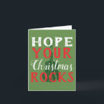 Cartão De Festividades Hope Your Christmas Rocks Greeting Card<br><div class="desc">Here's the perfect Christmas card for your favorite musician or music lover. Festive red and white text reads,  "Hope your Christmas Rocks" with a dark green guitar graphic and a green background.</div>
