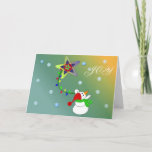 Cartão De Festividades Joyful Snowman<br><div class="desc">Neve Whimsical balançando sobre uma corda colorida de luzes de uma estrela. Flocos de neve ao fundo.</div>