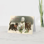 Cartão De Festividades Kitten Cat Curious Snowman Holly Wreath<br><div class="desc">Time to head home from church. This vintage Christmas print depicts children walking on a frozen pond,  carrying a Christmas tree and gifts. A church and full moon in the background.</div>