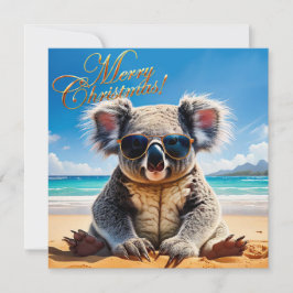 Cartão De Festividades Koala em uma praia arenosa Feliz Natal