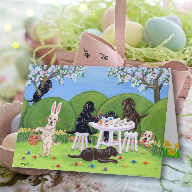 Cartão De Festividades Labradores e Ovos de Páscoa (Labradors and Easter Eggs Card featuring Labradors painting Easter Eggs and doing funny antics.  )