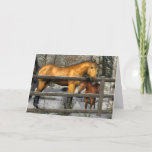 Cartão De Festividades Mare and Foal in Winter Christmas Card<br><div class="desc">This Christmas card features an original artwork of a buckskin mare and her bay foal beside a fence in a snowy winter landscape.  Horse lovers will enjoy receiving this Christmas card.</div>