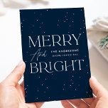 Cartão De Festividades Modern Navy Merry and Bright Non-Photo<br><div class="desc">Modern holiday card featuring "Merry and Bright" displayed in white lettering and navy background with subtle white dots (snow). Personalize the front of the non-photo holiday card with your family name and the year in white lettering. The card reverses to display your personal message in navy lettering or leave it...</div>
