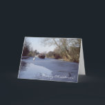 Cartão De Festividades Narrowboat on a frozen canal<br><div class="desc">A Christmas or New Year card with a photo of a vintage traditional large Woolwich narrowboat Aber breaking through the ice on the Grand Union Canal in the UK,  with a swan walking on the ice and a lock in the background.</div>