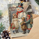 Cartão De Festividades Natais vintages Snowman com Crianças na Neve<br><div class="desc">Celebrar a magia do Natal com este delicioso cartão vintage com um clássico boneco de neve rodeado de crianças alegres. Perfeito por enviar desejos de férias calorosos a familiares e amigos!</div>