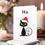 Cartão De Festividades Negro Engraçado Sentado Papai Noel Natal Cat<br><div class="desc">Mostra um gato preto com olhos verdes e cauda encaracolada. O gato veste um chapéu vermelho de Papai Noel e tem um ornamento de estrela de Natal pendurado na cauda. O texto acima diz "Ho", que é um "ho ho ho ho" sem entusiasmo. Personalize e personalize o texto dentro, que...</div>