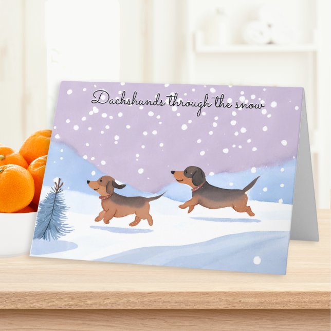 Cartão De Festividades O Cão De Neve Passa O Natal (A Christmas card with picture of two cute sausage dogs and caption 'Dachshunds through the snow')