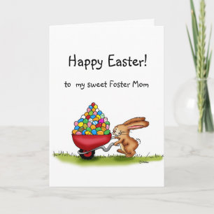 Cartão De Festividades O Coelhinho da Páscoa move ovos coloridos em uma c