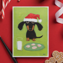 Papai noel engraçado do cão do Dachshund com leite
