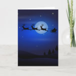 Cartão De Festividades Papais noeis de Natal com Reindeer<br><div class="desc">Imagem de Papais noeis de Natal que montam sua rena dormindo sobre o céu azul-escuro!</div>