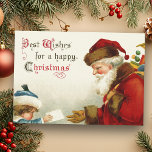 Cartão De Festividades Papais noeis e Crianças com Carta de Natal<br><div class="desc">Imagem nostálgica de um saco de brinquedos do Papai Noel,  rodeado vermelho,  da era Vitoriana,  recebendo uma carta de uma criança tímida em casaco azul e chapéu. Imagem complementar ao contrário com texto personalizável.</div>