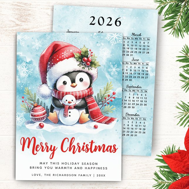 Cartão De Festividades Pinguim bonito azul e vermelho Feliz Natal (Merry Christmas Card with a Cute Penguin in a Santa Hat, 2026 Calendar on a Backside of the Card)