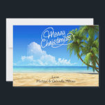 Cartão De Festividades Quente Sunny Beach Christmas Card<br><div class="desc">Desejos quentes de férias da praia. Em um roteiro branco diz: "Feliz Natal". Há um céu azul brilhante com palmeiras ao longo do lado saindo. O oceano com água azul de cristal está caindo na areia. Veja as muitas outras cenas de praia e produtos que temos em nossa loja.</div>