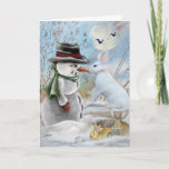 Cartão De Festividades Rabbit Eats Snowman's Nose Cards<br><div class="desc">Snowman with Carrot Nose and wearing Black and Red Christmas hat stands facing large white Rabbit who decides to eat the snowman's nose.</div>