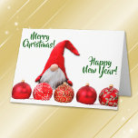 Cartão De Festividades Red Santa Gnome Christmas<br><div class="desc">On the front of this Holiday greeting card is a cute image of a little white bearded gnome wearing a red Santa hat that comes down over his eyes. He is standing behind a row of gold and silver decorated bright red tree bulbs. The green text on either side of...</div>