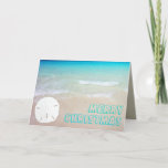 Cartão De Festividades Sand Dollar Beach Tropical Christmas Cards<br><div class="desc">Tropical beach and sand dollar Christmas cards.  Pretty turquoise and aqua blue water is the background for chunky,  open font style greeting.  Customize the text on the front and inside.  A single white sand dollar,  on a sandy beach,  decorates the front and is the background for text inside.</div>