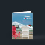 Cartão De Festividades Santa hat on beach chair<br><div class="desc">red and white beach chairs with Santa cap and waves crashing on rocks</div>