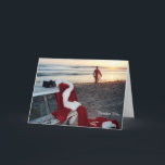 Cartão De Festividades Santa surfs the day after Christmas<br><div class="desc">I call this card December 26th. It was the first in a series that I created to combine Santa's love of all things beach and especially surfing. What else would Santa do on his first day off!</div>