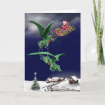 Cartão De Festividades Santas Dragon Sleigh<br><div class="desc">Father Christmas in sled being pulled by two flying dragons over a snowy village. Inside the card are some baby dragons with eggs and the words Merry Christmas and Happy New Year.</div>