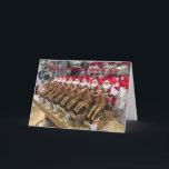 Cartão De Festividades Santas in a Row Christmas Greetings<br><div class="desc">A row of cheery Santas riding rocking horses to convey your personal Christmas message.</div>