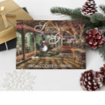 Cartão De Festividades Seasons Greetings Country Business Holiday Card<br><div class="desc">Corporate holiday card features a snowman on a holiday decorated small town back road and the words "Season's Greetings" in white typography and your company name on the front. The inside has a holiday greeting that you can change to your own. There is also a place to add your own...</div>