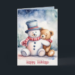 Cartão De Festividades Snowman De Natal E Urso De Teddy<br><div class="desc">Urso de pelúcia castanho,  de cor aquosa,  em flocos de neve com boneco de neve. O texto é editável.</div>