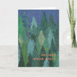 Cartão De Festividades Snowy Forest Christmas Card: Irish Gaelic<br><div class="desc">A chic Christmas Card with a forest of Christmas Trees in the snow,  from a handpainted paper collage design by Judy Adamson. The greeting on the front,  in orange/pink lettering,  is Merry Christmas in Irish Gaelic and you can personalise the inside message.</div>