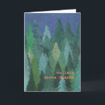 Cartão De Festividades Snowy Forest Christmas Card: Irish Gaelic<br><div class="desc">A chic Christmas Card with a forest of Christmas Trees in the snow, from a handpainted paper collage design by Judy Adamson. The greeting on the front, in orange/pink lettering, is Merry Christmas in Irish Gaelic and you can personalise the inside message. (Just one click of the button will resize...</div>