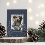 Cartão De Festividades Snowy Pine | Elegant Christmas Photo<br><div class="desc">A modern and elegant Christmas holiday card design featuring a single vertical photo on a navy blue background. Two tall pine trees frame your photo,  dotted with white snow. Personalize with your custom holiday greeting,  family name and the year.</div>