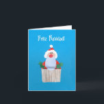 Cartão De Festividades Spanish Christmas 'Cupcake with Santa' Card<br><div class="desc">A smaller sized Spanish Christmas Card with a Santa on top of a cupcake,  from a handpainted paper collage by Judy Adamson. Please contact me through my store if you would like the front cover text changed and the inside is left blank for your own message.</div>