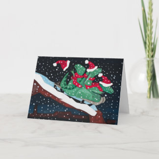 Cartão De Festividades Three sledding dinosaurs