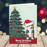 Cartão De Festividades Tricolor Corgi personalizado bonito no Natal de Sa<br><div class="desc">Este lindo cão tricolor Pembroke Welsh Corgi tem a cabeça inclinada dentro de um bonitinho chapéu de Papai Noel. O filhote está sentado em frente a uma bonito árvore de Natal decorada com ornamentos coloridos. Feliz Natal está escrito na frente com encantadora cursiva neste cartão de festas de estimação com...</div>