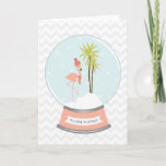 Cartão De Festividades Tropical Island Flamingo Christmas - Pink<br><div class="desc">A winter / Christmas card featuring an illustration of a pink flamingo inside a snowglobe.  
Flamingo is wearing a red striped scarf and hat while perched on a snow covered island with two palm trees.  Pink base says,  "WARM WISHES."  Background is gray chevron.</div>