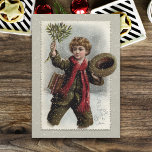 Cartão De Festividades Vintage Boy na neve com feliz saudação de Natal<br><div class="desc">Vintage vintage de cabelos encaracolados caminhando pela neve derrubando seu chapéu e acenando com uma saudação de Feliz Natal.</div>
