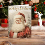 Cartão De Festividades Vintage Papais noeis Feliz Natal<br><div class="desc">Mande desejos de férias calorosos com este nostálgico cartão de Natal, com um Papai Noel de estilo judeu, parado em uma cena de neve. As palavras Feliz Natal aparecem no elegante guião dourado no topo, fazer uma maneira eterno de partilhar alegria festiva com amigos, família e colegas de trabalho. Perfeito...</div>