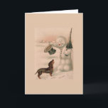 Cartão De Festividades Vintage - Snowman saúda um Dachshund,<br><div class="desc">Uma ilustração vintage de um boneco de neve fazendo seu chapéu e curvando sua cabeça em cumprimentos a um cão Dachshund que o aproximou em um dia de inverno nevado.  Este cartão é vazio de dentro para sua própria mensagem.</div>