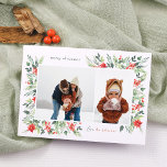 Cartão De Festividades Winter Botanicals & Holly Felly Natal 2 Foto<br><div class="desc">Um design elegante, com duas fotos personalizadas: uma paisagem e um retrato, dentro de um quadro branco chic. O quadro é aninhado dentro da delicada folhagem de aquarela, criando um layout naturalmente orgânico. A folhagem inclui folhas verdes e bagas vermelhas brilhantes. Há flores de poinsettia vermelha e ramos de pinho....</div>