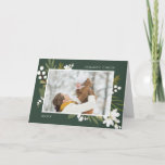 Cartão De Festividades Winter Greenery | Photo Folded Holiday Card<br><div class="desc">Elegant botanical holiday photo card puts your favorite family photo front and center, accented by green botanical sprigs, foliage, leaves and white lily of the valley flowers, on a rich hunter green background. Add your custom Christmas greeting (shown with "merry everything") and the year. Personalize the inside of this folded...</div>