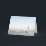 Cartão De Festividades Winter in Holland christmas greeting card<br><div class="desc">A Christmas greeting card showing a windmill with a fence and a canal in the snow in a landscape in Holland in winter.</div>