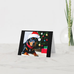Cartão de Natal com Rottweiler vestindo chapéu de 