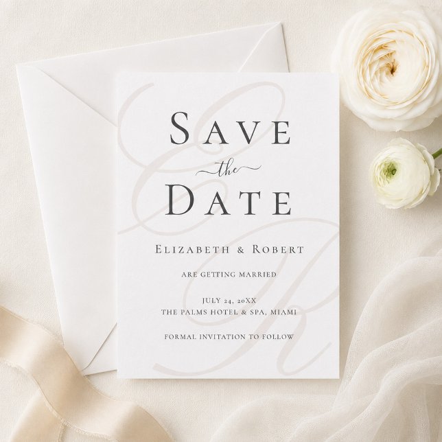 Cartão de Salvar a Data com Monograma Minimalista (Minimalist Monogram Save the Date Card on a table with white flowers and a silk ribbon)