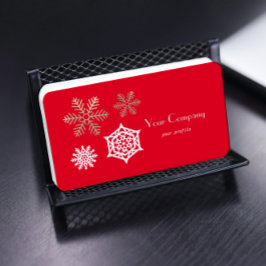 Cartão De Visita flocos de neve dourados e brancos contra o vermelh