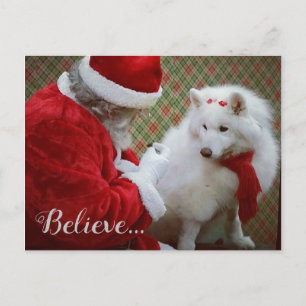 Cartão do Natal do Samoyed e do papai noel