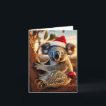 Cartão Feliz Natal Koala sentado em Gumtree<br><div class="desc">Koala australiano sentado numa árvore vestindo um chapéu de santa. Dentro: "Feliz Natal e Feliz ano novo" Este coala peludo é um nativo da Austrália que eles são facilmente reconhecíveis por seu corpo escondido e cabeça grande com orelhas redondas,  lisas e nariz grande e em forma de colher.</div>