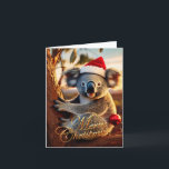 Cartão Feliz Natal Koala sentado em Gumtree<br><div class="desc">Koala australiano sentado numa árvore vestindo um chapéu de santa. Dentro: "Feliz Natal e Feliz ano novo" Este coala peludo é um nativo da Austrália que eles são facilmente reconhecíveis por seu corpo escondido e cabeça grande com orelhas redondas,  lisas e nariz grande e em forma de colher.</div>