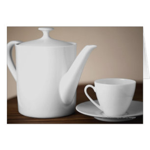 Cartão Fim-acima de um copo e de uns pires com uma