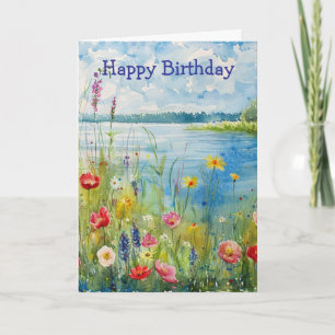 Cartão Flores silvestres de aniversário junto a um lago